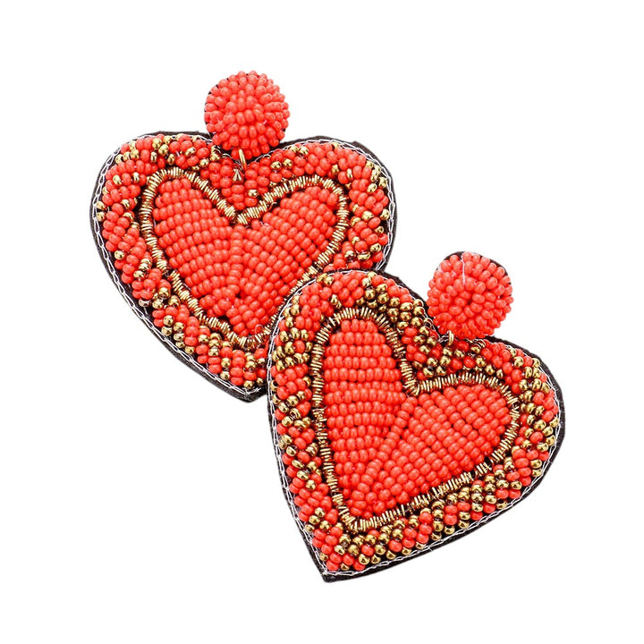 Red  Seed Bead Heart Earrings are handcrafted with tiny seed beads, making them lightweight and comfortable to wear. Perfect for adding a touch of whimsy to any outfit, these earrings are ideal for everyday wear or special occasions. The unique heart shape adds a romantic and playful touch to your look.