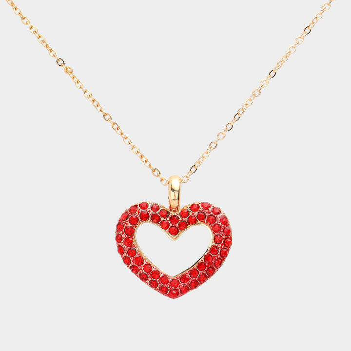 Rhinestone Embellished Open Heart Pendant Necklace is the perfect accessory for adding a touch of glamour to any outfit. Featuring sparkling rhinestones and a dainty open-heart pendant, this necklace exudes elegance and sophistication. With its versatile design, it can be worn for any occasion and is sure to make a statement. Elevate your style with this stunning piece.