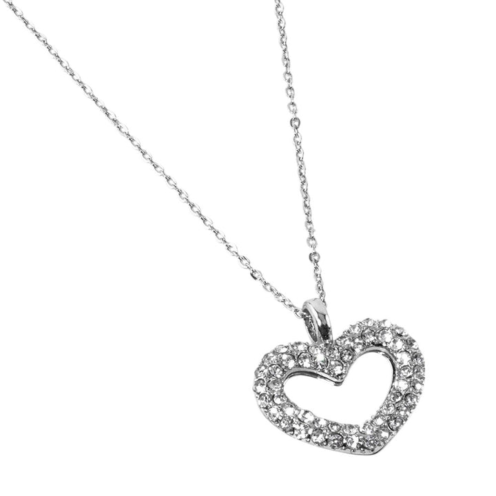 Rhinestone Embellished Open Heart Pendant Necklace is the perfect accessory for adding a touch of glamour to any outfit. Featuring sparkling rhinestones and a dainty open-heart pendant, this necklace exudes elegance and sophistication. With its versatile design, it can be worn for any occasion and is sure to make a statement. Elevate your style with this stunning piece.