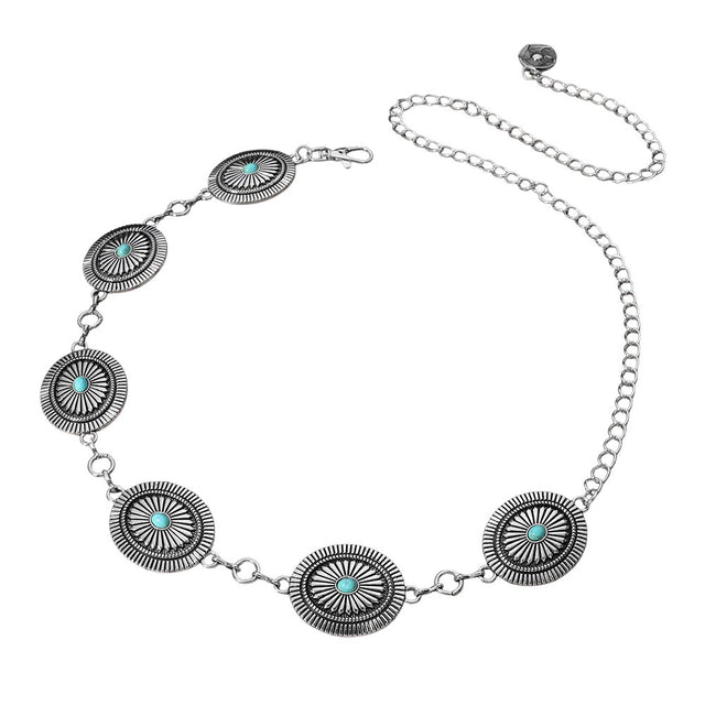 Rhodium Boho Vintage Western Turquoise Stone Pointed Concho Chain Belt is a versatile accessory for any bohemian or western-inspired outfit. The stunning turquoise stones and intricate pointed conchos add a unique vintage touch to your look. The chain design allows for an adjustable fit and adds an edgy element to your ensemble. Complete your outfit with this must-have boho belt. 