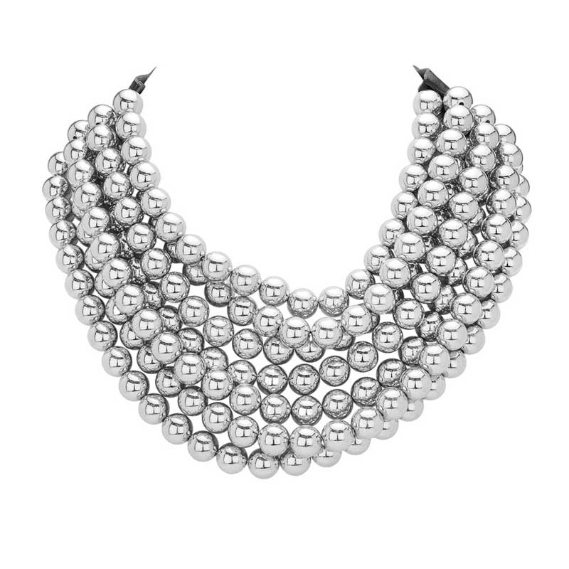 Rhodium Chunky Metal Ball Beaded Multi Layered Faux Leather Magnetic Necklace, Add a bold touch to your wardrobe with this necklace. Featuring multiple strands of soft faux leather adorned with chunky metal ball beads, this statement necklace effortlessly elevates any outfit. The magnetic clasp ensures easy wear.