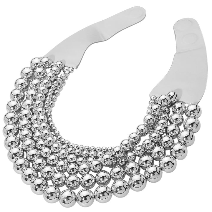 Chunky Metal Ball Beaded Multi-Layered Faux Leather Magnetic Necklace combines bold design with functional elegance. Crafted with layered faux leather strands accented by substantial metal ball beads, it delivers a textured, contemporary look. The magnetic clasp provides secure, easy fastening, enhancing wearability without compromising style. Ideal for professionals seeking a statement accessory that balances durability and modern sophistication. 