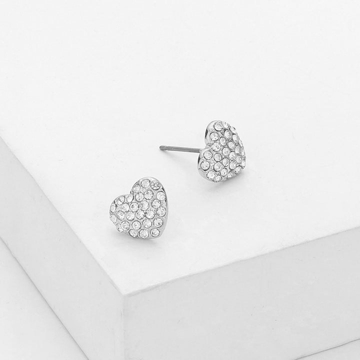 Rhodium-Crystal Stone Paved Heart Stud Earrings add a touch of sparkle to any outfit. Expertly crafted with crystal stones, they offer a timeless and elegant look. Perfect for any occasion, these earrings are a must-have for any jewelry collection.