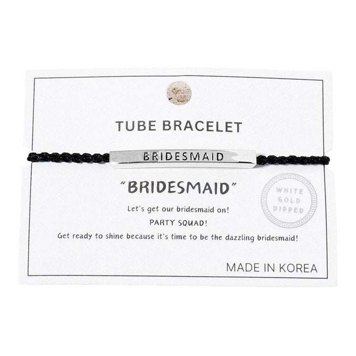 Rhodium-Gold-Dipped BRIDESMAID Message Bar Pointed Rope Adjustable Cinch Pull Tie Bracelet, the perfect accessory for your wedding party. Featuring an adjustable cinch pull tie, it ensures a comfortable and secure fit for any wrist size. The dipped BRIDESMAID message bar adds a special touch to thank your loved ones.