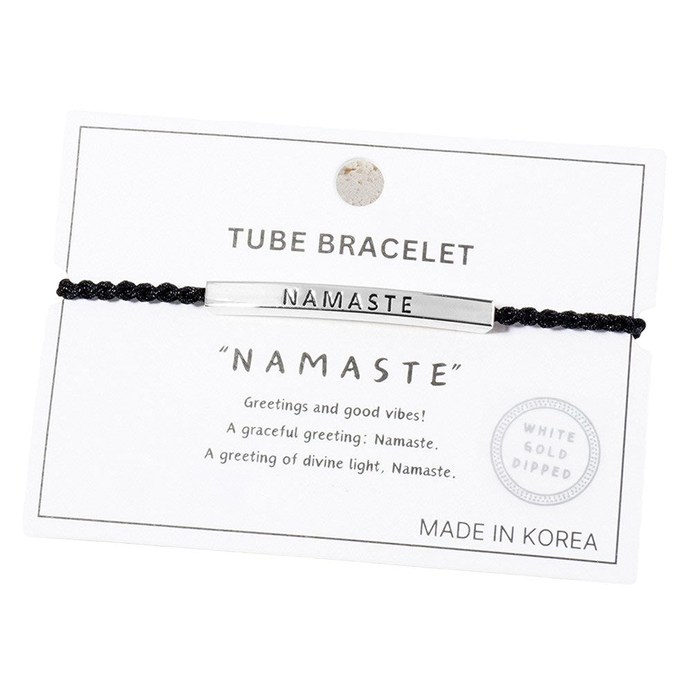 Rhodium-Gold-Dipped NAMASTE Message Bar Pointed Rope Bracelet is a versatile and stylish addition to any outfit. The dipped finish adds a touch of elegance, while the adjustable rope design allows for a perfect fit. Show off your spiritual side with the NAMASTE message bar, a reminder to always stay centered and at peace