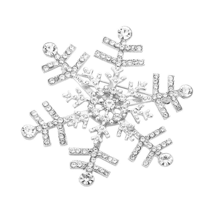 Elegant snowflake brooch adorned with shimmering crystals, perfect for adding a festive touch to coats, scarves, or winter outfits. A charming accessory that brings seasonal sparkle and refined style to any look.