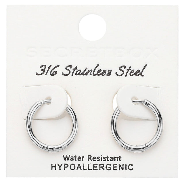 Rhodium SECRET BOX Stainless Steel Huggie Hoop Earrings offer a sleek and durable design. Made from high-quality stainless steel, they are hypoallergenic and perfect for everyday wear. Their huggie hoop style ensures a secure fit, making them the ideal accessory for any occasion.