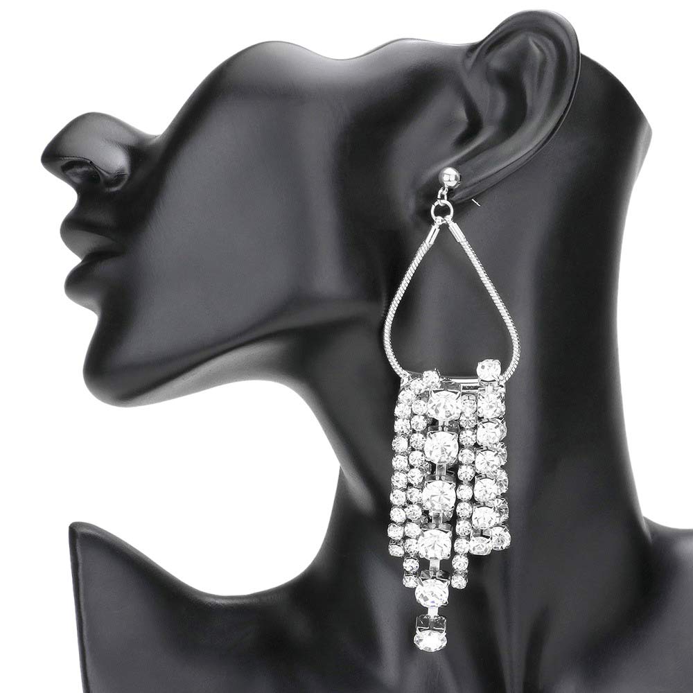 Rhodium Secret Box Open Metal Bubble Stone Fringe Evening Earrings, showcase a stylish teardrop design with bubble stone accents and fringe detailing. Crafted in stunning compliant metal, these earrings will bring a touch of glamour to any special occasion outfit. Perfect gift item for anyone you care about on any special day.