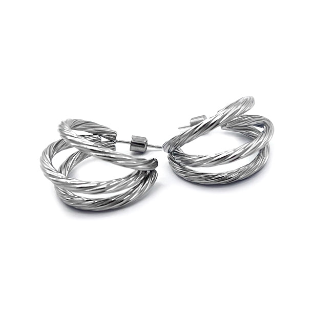 Rhodium Stainless Steel Textured Split Hoop Earrings are a must-have for any fashion-forward individual. Made of durable stainless steel, these earrings feature a unique textured design that adds a touch of sophistication to any outfit. With a split hoop design, they are a versatile addition to any jewelry collection.