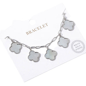 Rhodium White Gold Dipped Quatrefoil Charm Station Bracelet, is the perfect accessory for any occasion. Crafted from quality materials, it features an attractive quatrefoil charm station and a classic clasp for added security. The perfect blend of fashion and function. Excellent gift for the people you love on any occasion.