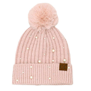 Rose C.C Pearl Embellishments Pom Pom Beanie Hat, this stylish beanie is made from high-quality material for a comfortable and snug fit. Featuring pearl embellishments and a pom pom detail, this hat is sure to keep you looking stylish and chic in chilly weather. Perfect winter gift for friends and family.