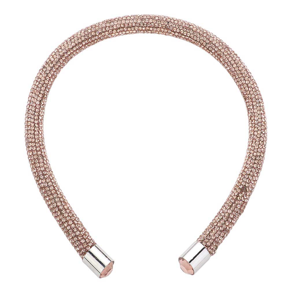 ROse Gold Bling Headband. This stylish accessory is crafted with dazzling jewels and adds a touch of elegance to any outfit. Perfect for special occasions and everyday wear, the Bling Headband is sure to make a statement. Enhance your look with this must-have accessory.