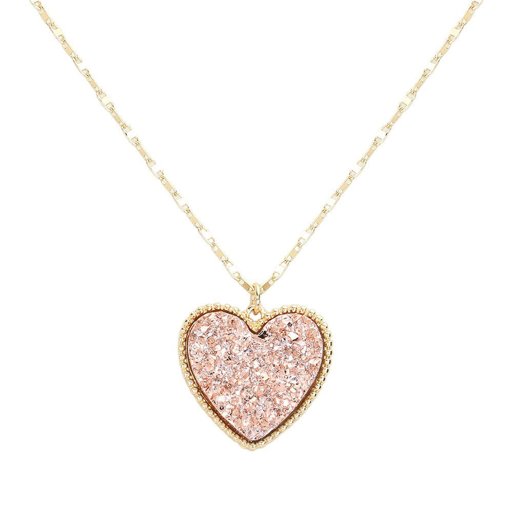 Rose Gold Druzy Heart Pendant Necklace, this is a stunning accessory that adds a touch of sparkle to any outfit. The druzy heart pendant is beautifully crafted and catches the light for a mesmerizing effect. With its unique design and high-quality materials, this necklace is sure to make a statement and elevate your look.