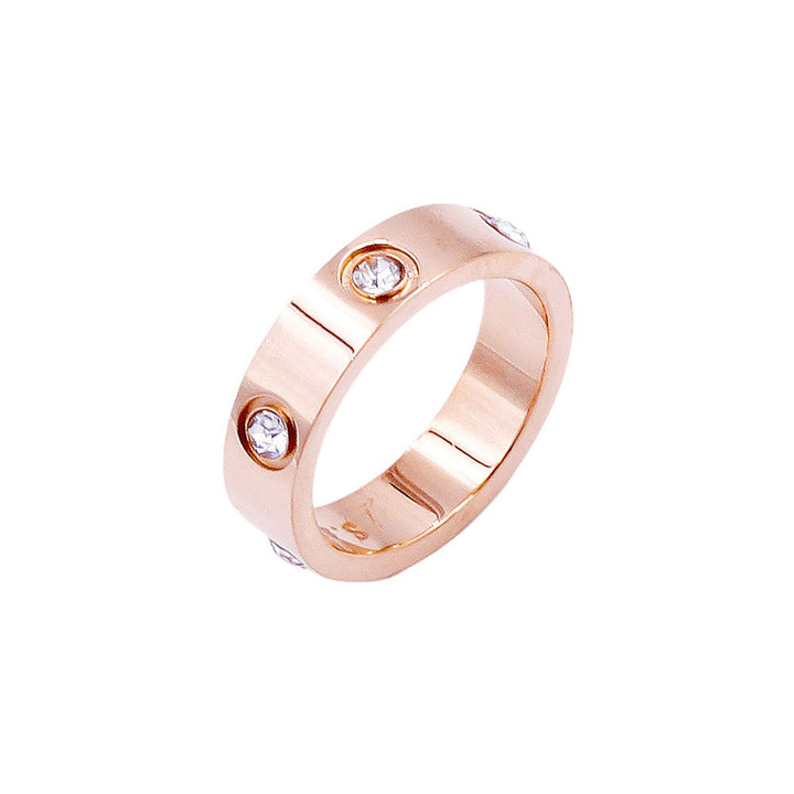 Rose-Gold-Stone Embellished Stainless Steel Band Ring is an elegant and durable accessory. The stainless steel material offers strength and resistance to tarnishing, while the stone embellishments add a touch of sophistication. Perfect for everyday wear or special occasions.