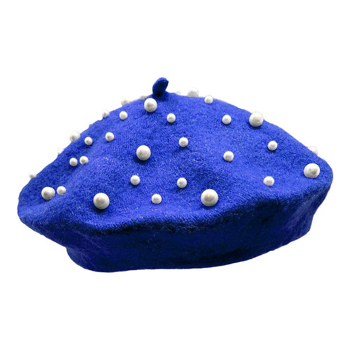 Royal-Blue-Pearl Embellished Tam Beret Hat, Featuring a classic beret design, this stylish hat is adorned with elegant pearls for a touch of sophistication.Adding a touch of glamour to any outfit, this hat is a must-have accessory for any fashion-forward individual.Upgrade your style today with our Pearl Embellished Tam Beret Hat