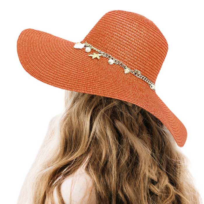 Rust Pearl Starfish Shell Charm Band Pointed Straw Sun Hat, is perfect for any beach or outdoor occasion. The beautifully crafted pearl and shell band adds a touch of glamour, while the pointed straw design provides ample shade and breathability. Stay stylish and protected from the sun with this must-have accessory. 