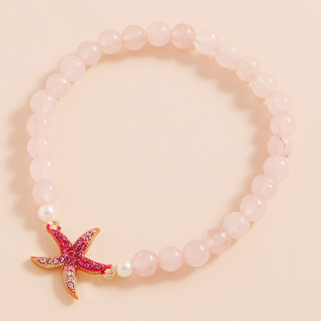 Gold, Pink Stone Paved Colored Metal Starfish Faceted Beaded Stretch Bracelet