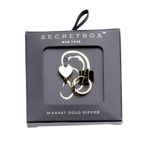 SECRET BOX_14K Gold Dipped Heart Huggie Hoop Earrings are a timeless addition to any jewelry collection. Made with 14K gold plating, these earrings feature a delicate heart design and a secure huggie hoop closure. Elevate your style and add a touch of luxury to any outfit with these elegant earrings.
