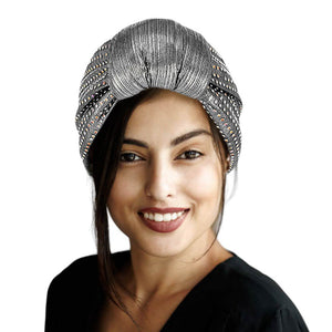 Silver Bling Turban Hat, this stylish hat is sure to turn heads. Crafted using premium materials, the hat features a modern design with sparkling sequins to create an eye-catching look. Perfect for special occasions, this hat is sure to add a touch of glamour to any outfit. Fashionable winter gift idea.