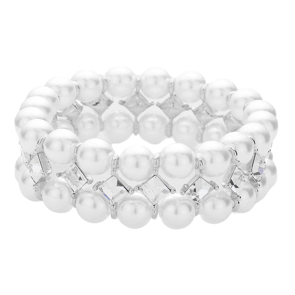 Silver Indulge in the effortless grace of our Square Stone Accented Pearl Stretch Bracelet. Adorned with square stones that delicately frame lustrous pearls, this bracelet exudes luxury and elegance. The stretch design allows for a comfortable and versatile fit. Elevate your style with this addition to your jewelry collection