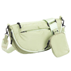 Sage Green Puffer Half Moon Crossbody Bag, the lightweight, stylish design features a durable water-resistant nylon that is perfect for outdoor activities. The adjustable shoulder strap makes it easy to sling across your body for hands-free convenience. Carry your essentials in style and comfort with this fashionable bag.