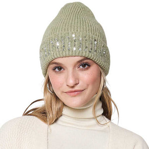 Sage Green Solid Ribbed Sequin Cuff Beanie Hat, is perfect for staying warm and stylish in cold weather. Its ribbed knit construction and sequin cuff add structure and texture, while providing warmth and comfort. It is lightweight and easy to pack, making it an ideal accessory for any cold-weather excursion or an exquisite gift.