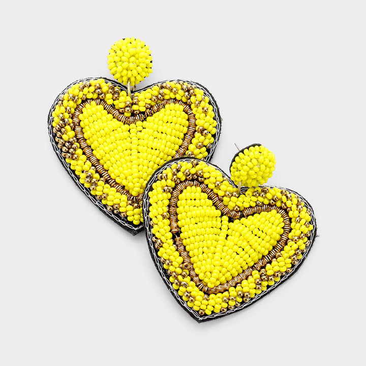 Yellow Seed Bead Heart Earrings are handcrafted with tiny seed beads, making them lightweight and comfortable to wear. Perfect for adding a touch of whimsy to any outfit, these earrings are ideal for everyday wear or special occasions. The unique heart shape adds a romantic and playful touch to your look.