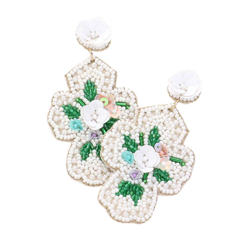 White Seed Beaded Flower Cross Dangle Earrings. Add a touch of elegance to your ensemble with our Seed Beaded Flower Cross. These handcrafted earrings feature a delicate flower design with a cross accent. Made with quality materials and intricate detailing, they are sure to elevate your style.