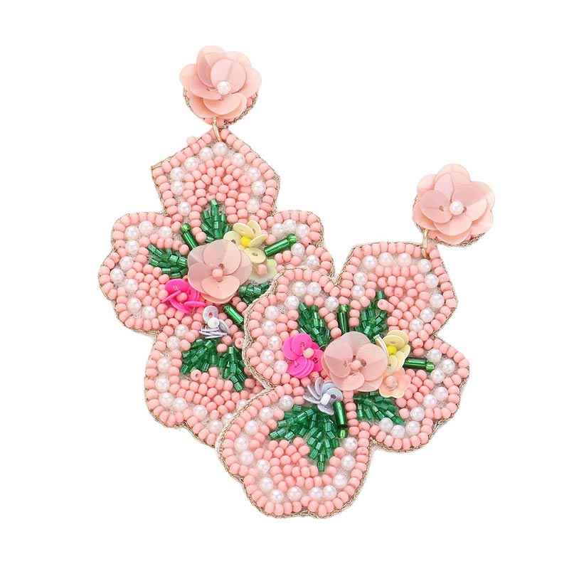 Mint Seed Beaded Flower Cross Dangle Earrings. Add a touch of elegance to your ensemble with our Seed Beaded Flower Cross. These handcrafted earrings feature a delicate flower design with a cross accent. Made with quality materials and intricate detailing, they are sure to elevate your style.