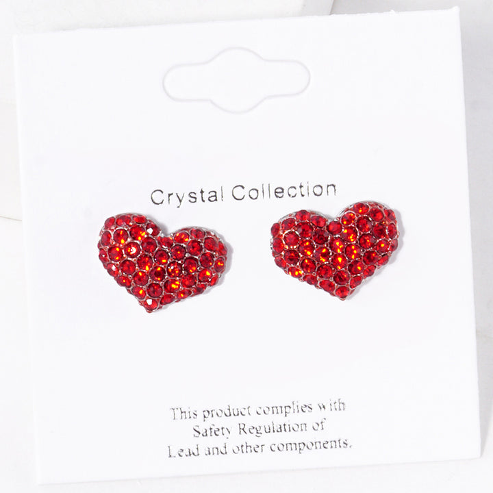 Siam-Crystal Pave Heart Stud Earrings are expertly crafted with sparkling crystals, adding a touch of elegance to any outfit. Made with precision and attention to detail, they are perfect for special occasions or everyday wear. Upgrade your style with these stunning earrings.