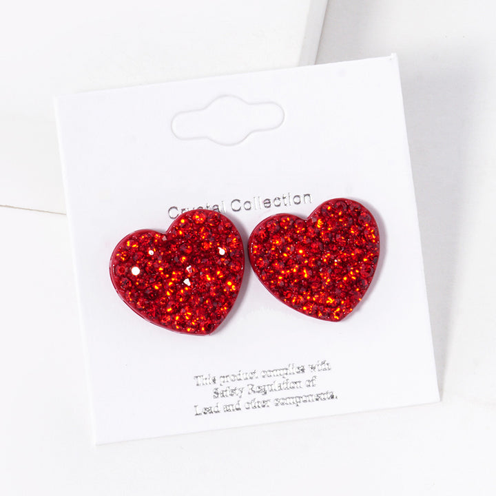 Siam-Crystal Stone Paved Heart Stud Earrings feature a sparkling design that adds a touch of elegance to any outfit. Crafted with expert precision and quality materials, these earrings are perfect for any occasion. The heart-shaped studs are encrusted with shimmering crystals, making them a stunning addition to any jewelry collection. 