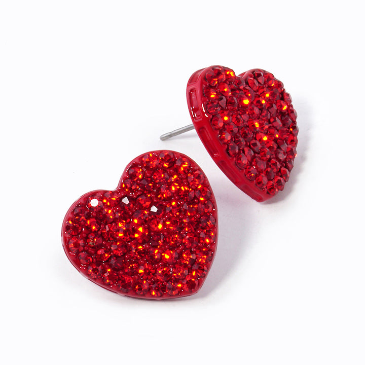 Siam-Crystal Stone Paved Heart Stud Earrings feature a sparkling design that adds a touch of elegance to any outfit. Crafted with expert precision and quality materials, these earrings are perfect for any occasion. The heart-shaped studs are encrusted with shimmering crystals, making them a stunning addition to any jewelry collection. 