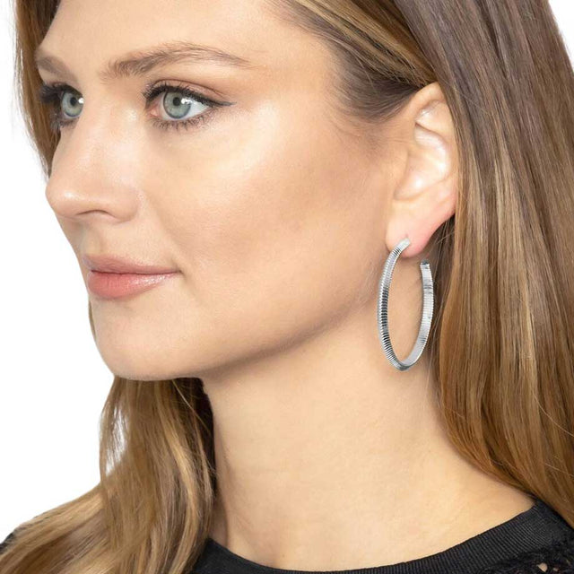Silver 1.6 Inch Textured Brass Metal Hoop Earrings, turn your ears into a chic fashion statement with these brass metal hoop earrings! The beautifully crafted design adds a gorgeous glow to any outfit. Put on a pop of color to complete your ensemble in perfect style. These adorable textured earrings are bound to cause a smile.