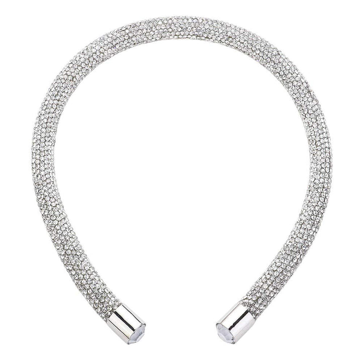 Silver Bling Headband. This stylish accessory is crafted with dazzling jewels and adds a touch of elegance to any outfit. Perfect for special occasions and everyday wear, the Bling Headband is sure to make a statement. Enhance your look with this must-have accessory.