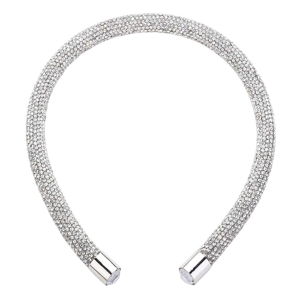 Silver Bling Headband. This stylish accessory is crafted with dazzling jewels and adds a touch of elegance to any outfit. Perfect for special occasions and everyday wear, the Bling Headband is sure to make a statement. Enhance your look with this must-have accessory.