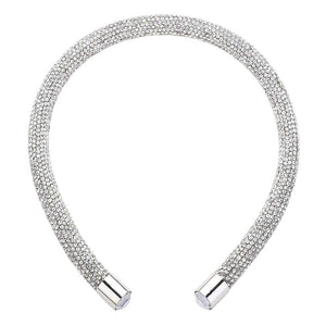 Silver Bling Headband. This stylish accessory is crafted with dazzling jewels and adds a touch of elegance to any outfit. Perfect for special occasions and everyday wear, the Bling Headband is sure to make a statement. Enhance your look with this must-have accessory.