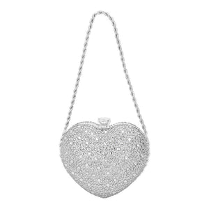 Silver Bling Heart Evening Clutch Bag, adds a touch of glamour to your evening look. With intricate stone detailing in the shape of a heart, this clutch is sure to make a statement. Perfect for special occasions, it also offers a secure clasp closure and a spacious interior. A Perfect Valentine's gift for your loved ones!
