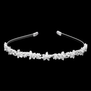 Silver CZ Flower Cluster Headband features sparkling CZ flowers that add a touch of elegance to any hairstyle. The headband is perfect for weddings, parties, or any special occasion. Crafted with meticulous attention to detail, this headband is sure to make a statement. Elevate your look with the CZ Flower Cluster Headband.