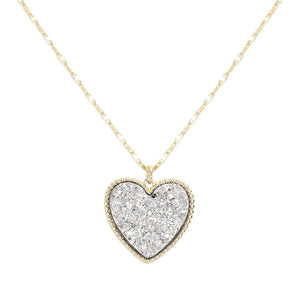 Silver Druzy Heart Pendant Necklace, this is a stunning accessory that adds a touch of sparkle to any outfit. The druzy heart pendant is beautifully crafted and catches the light for a mesmerizing effect. With its unique design and high-quality materials, this necklace is sure to make a statement and elevate your look.