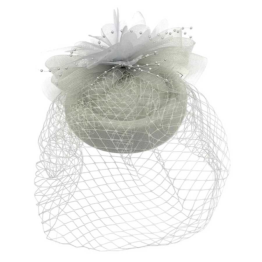 Silver Floral Pearl Mesh Fascinator Headband, the perfect accessory for special or casual occasions. Crafted from supple mesh and finished with lush faux pearls, this Fascinator Headband elevates any look. A timeless and elegant piece, sure to be a favorite. A perfect gift on any occasion to your family members or a close one