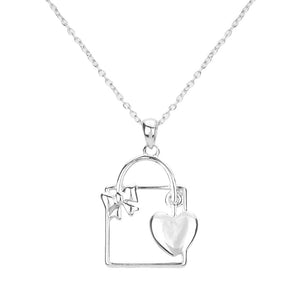 Silver Metal Cut Out Ribbon Heart Lock Pendant Necklace, is a beautiful addition to showing off your lovely heart in a stylish way. It's a complete glamor that amps up your beauty to a greater extent. An excellent gift idea for the persons you love and care about the most. It makes your look unique and attracts everyone to smile at you with joy.