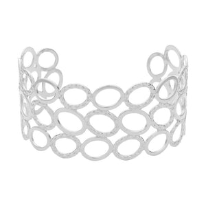 Silver Metal Open Oval Cuff Bracelet. This elegant piece features a unique design and an open oval shape, making it perfect for adding a touch of sophistication to any outfit. Crafted with quality metal, it is durable and comfortable to wear. Elevate your fashion game with this statement piece.