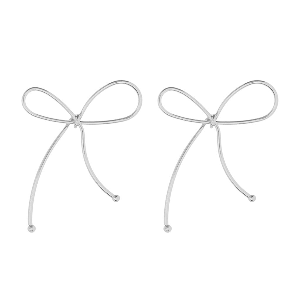 Silver Metal Wire Bow Earrings, Expertly crafted from high-quality metal wire, these bow earrings are the perfect addition to any outfit. The delicate design adds a touch of elegance, and sophistication to any outfit, these earrings are lightweight and comfortable to wear. Perfect for special occasions or everyday wear.