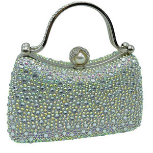 Silver Multi Crystal Diamond Top Handle Embellished Evening Clutch Bag is a remarkable evening bag, crafted from premium materials with a crystal diamond top handle for a special touch. Featuring a soft-textured fabric lining and a stylish, elegant exterior, this clutch bag is ideal for special occasions. 