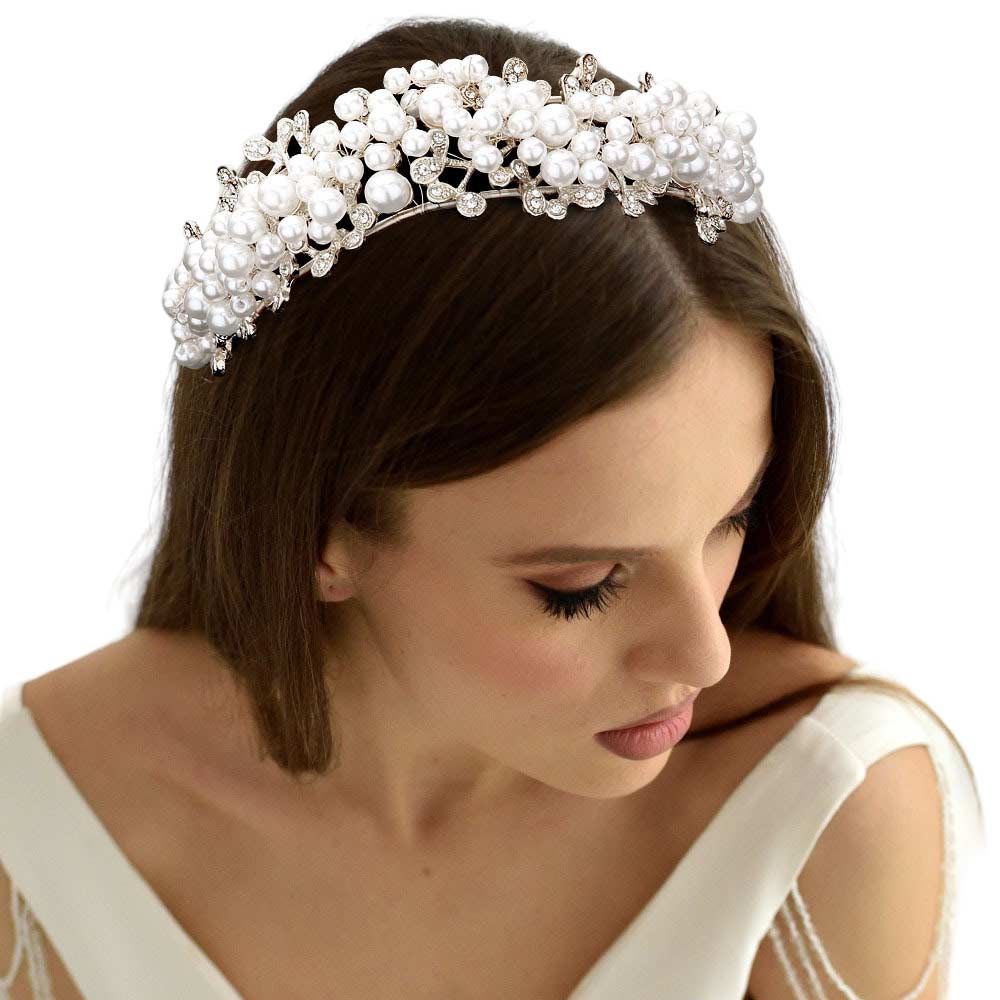 Silver Pearl Cluster Headpiece, Impress your friends and family with this beautiful piece of ornament. Perfect for a special occasion or as a gift, this stunning piece is adorned with gorgeous pearls and finished off with a subtle sparkle. Enhance any look with this timeless and elegant hair accessory.
