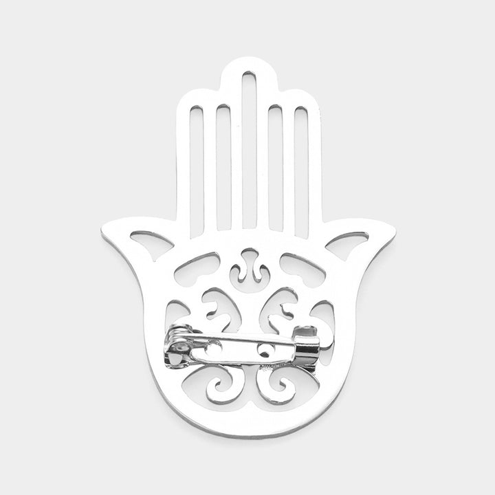 Silver Stainless Steel Cutout Hamsa Hand Pin Brooch is a beautiful and durable accessory, perfect for adding a touch of elegance to any outfit. Made of high-quality stainless steel, it features a delicate and intricate cutout design that showcases the symbolic Hamsa hand. With its superior material and craftsmanship, this brooch is sure to become a staple piece in your collection.