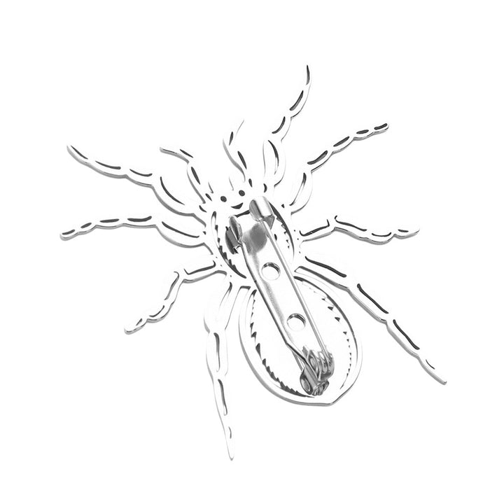Silver Stainless steel cutout spider pin brooch is a sleek and stylish accessory that adds a touch of edginess to any outfit. Made from high-quality stainless steel, it is durable and long lasting, making it a great addition to your jewelry collection. With its unique design and expert craftsmanship, this pin brooch is sure to make a statement.
