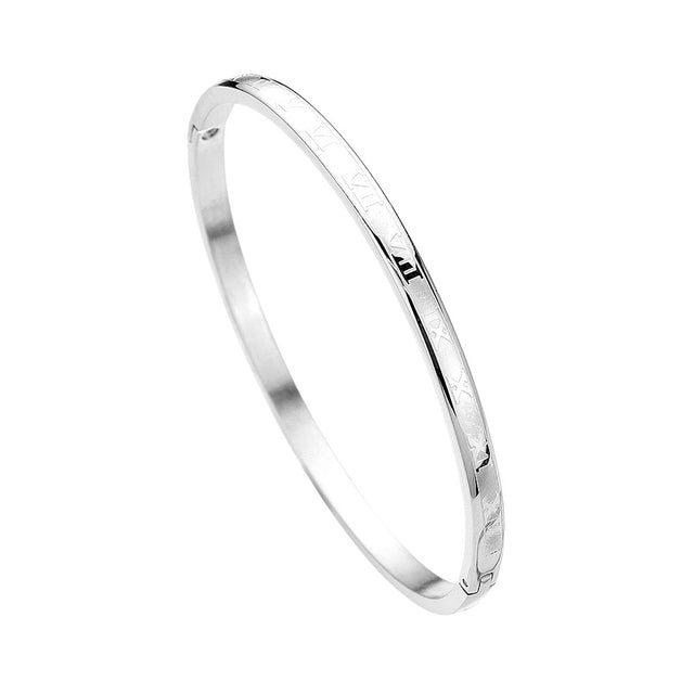 Silver Stainless Steel Roman Numerals Hinged Bangle Bracelet combines timeless style with durable materials. Crafted from stainless steel, this bracelet features Roman numerals for a classic touch. The hinged design allows for easy on and off, making it the perfect accessory for any outfit.