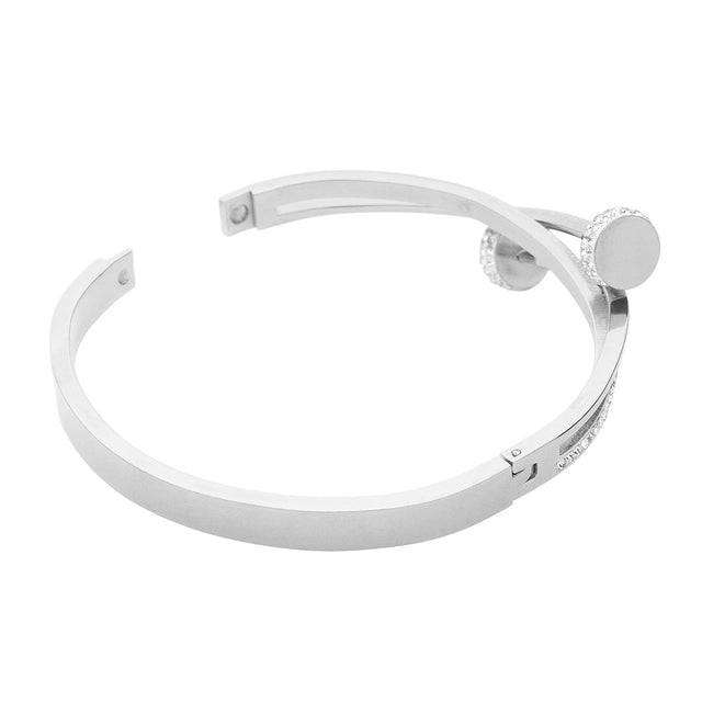 Silver Stainless Steel Stone Paved Nail Head Pointed Hinged Bracelet is a sleek and stylish accessory perfect for any occasion. Made of durable stainless steel and adorned with stones, this bracelet adds a touch of elegance to any outfit. Its pointed hinged design allows for a comfortable and secure fit. Upgrade your look with this modern and sophisticated bracelet.
