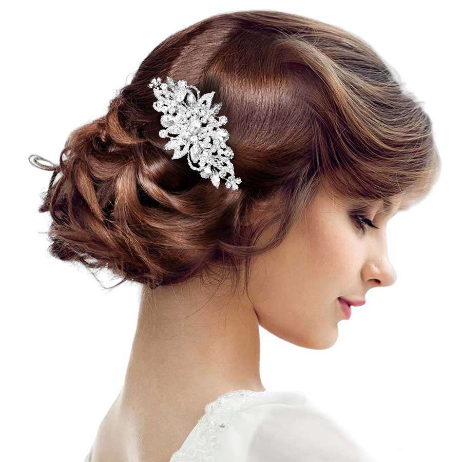 Silver Stone Cluster Flower Hair Comb, is an elegant hair accessory for any special occasion. The comb features a flower-shaped cluster of stones, designed to help you stand out. The comb itself is made from durable material, ensuring it will stay in place no matter what. The perfect way to accentuate any hairstyle and look.